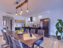 a kitchen with a dining room table